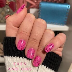 Color Street, Exes and Oh’s, fuchsia shade with pink, red, silver sparkles